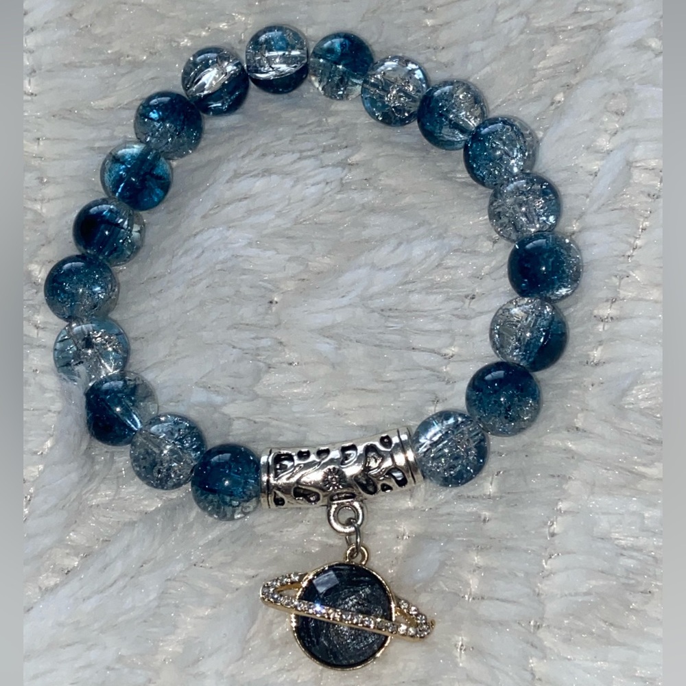 Handmade bracelet 📿 with Saturn planet pendant 🪐 and blue crackle beads